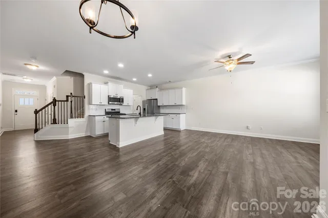 a view of kitchen with cabinets and wooden floor