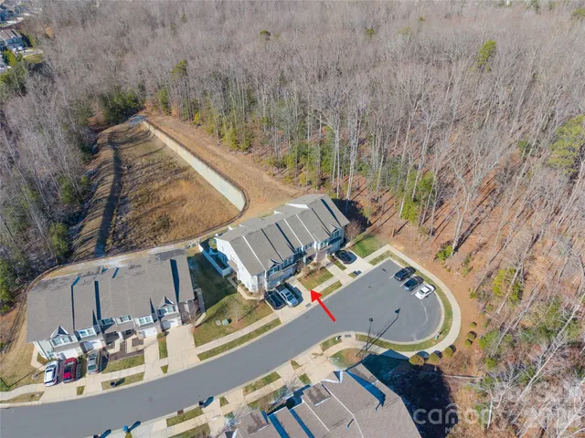 an aerial view of a house with outdoor space