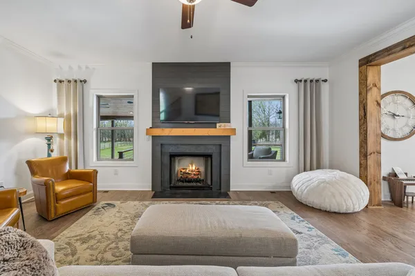 a living room with furniture and a fireplace