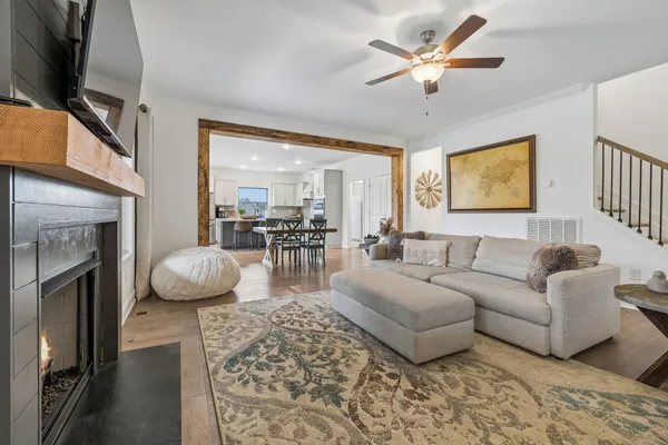 a dining room with furniture and a clock