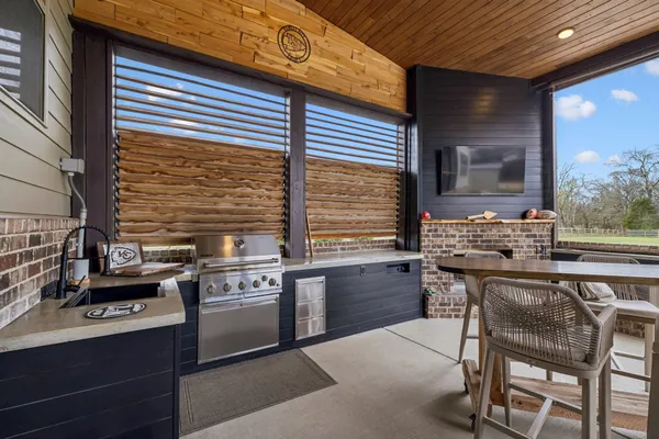 a kitchen with stainless steel appliances granite countertop a stove and a sink