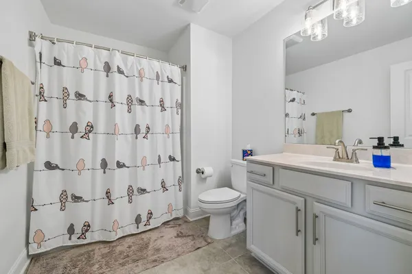 a spacious bathroom with a double vanity sink mirror and a