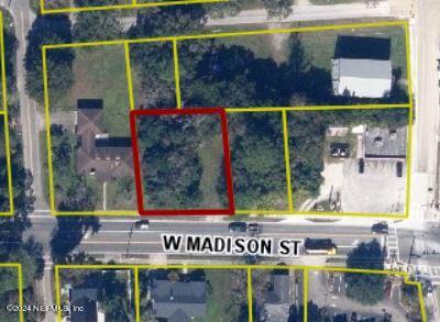 661 West Madison Street Starke, FL 32091 - Photo 9 of 12 a view of a brick building with a sign on the wall