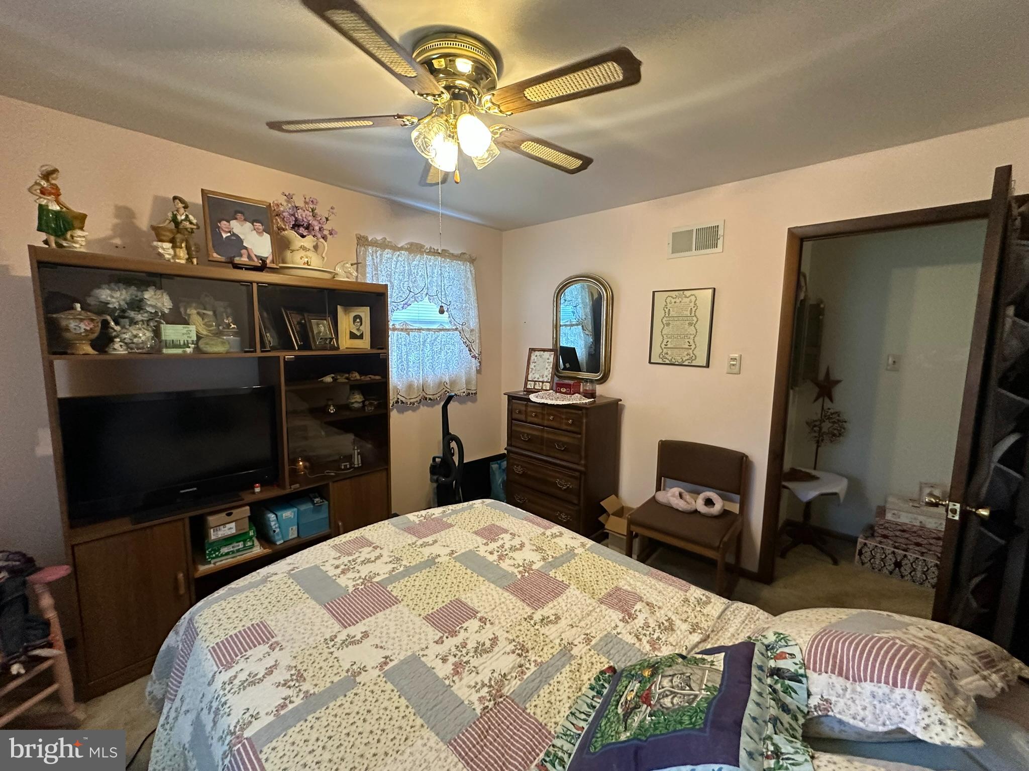 4829 Lehman Road Spring Grove, PA 17362 - Photo 21 of 42 a bedroom with a bed and a flat tv screen on dresser