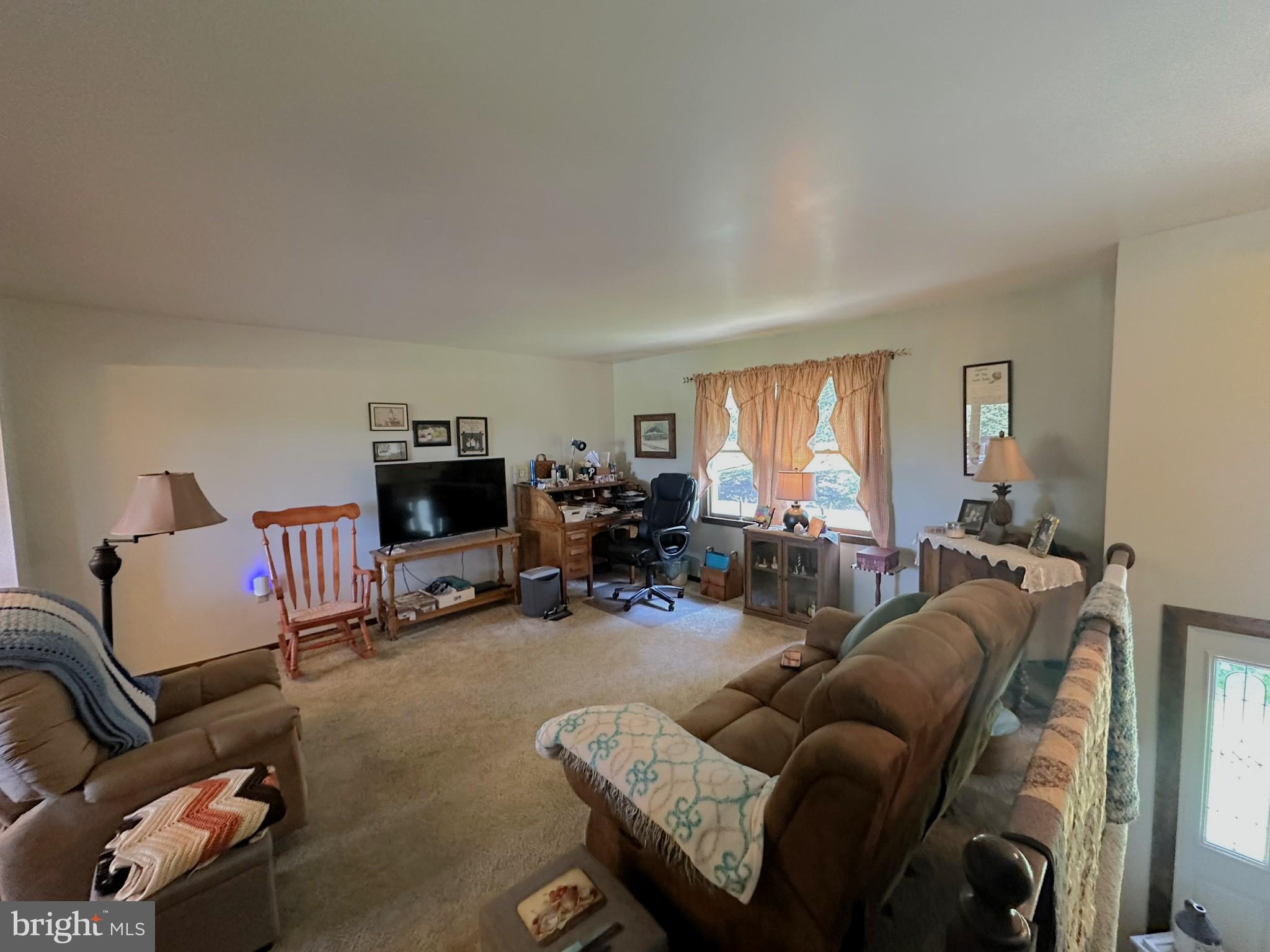 4829 Lehman Road Spring Grove, PA 17362 - Photo 6 of 42 a living room with furniture a window and a flat screen tv