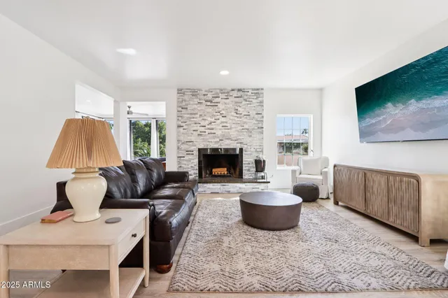 a living room with furniture and a rug