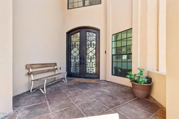 a view of a livingroom with a furniture and a gate