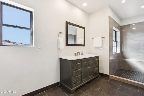 a living room with furniture a rug and a fireplace