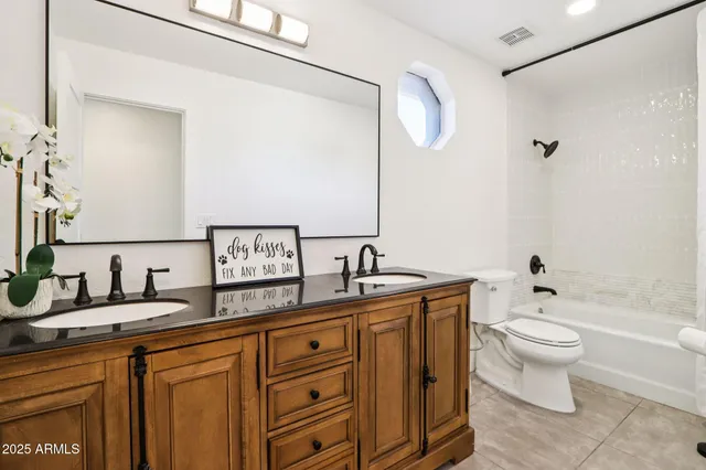 an aerial view of residential building with green space