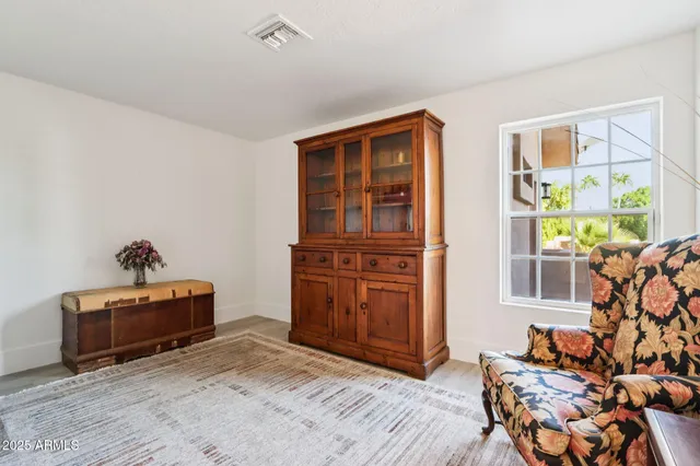 an aerial view of a house with backyard and outdoor seating