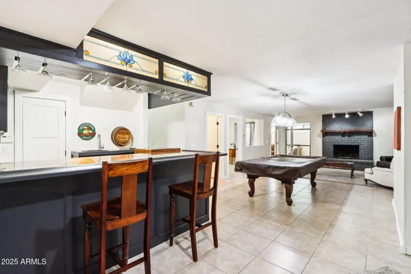 a swimming pool with outdoor seating and yard