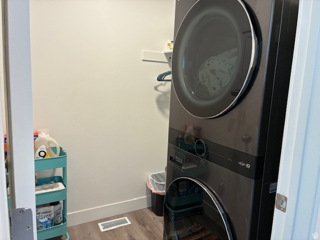 1249 West 1820th Street South Logan, UT 84321 - Photo 13 of 15 Laundry area featuring light wood finished floors and stacked washer / drying machine