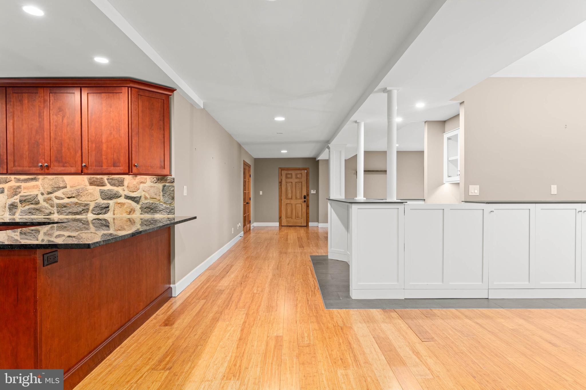 1311 Hagys Ford Road Penn Valley, PA 19072 - Photo 15 of 80 a view of a kitchen with kitchen island granite countertop wooden cabinets and stainless steel appliances