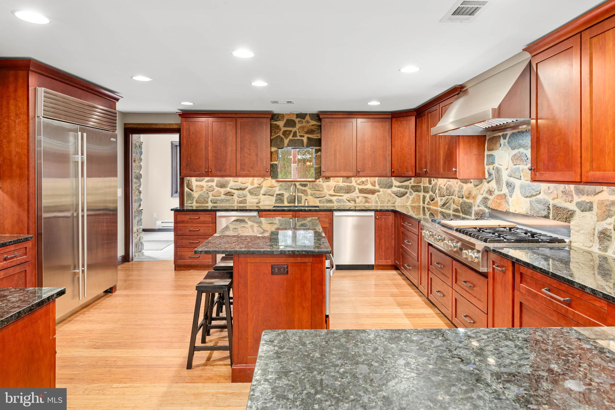 1311 Hagys Ford Road Penn Valley, PA 19072 - Photo 16 of 80 a kitchen with stainless steel appliances granite countertop wooden cabinets and sink