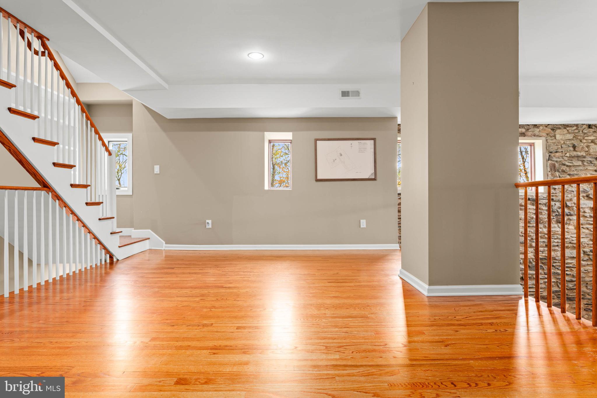 1311 Hagys Ford Road Penn Valley, PA 19072 - Photo 27 of 80 a view of an empty room with wooden floor