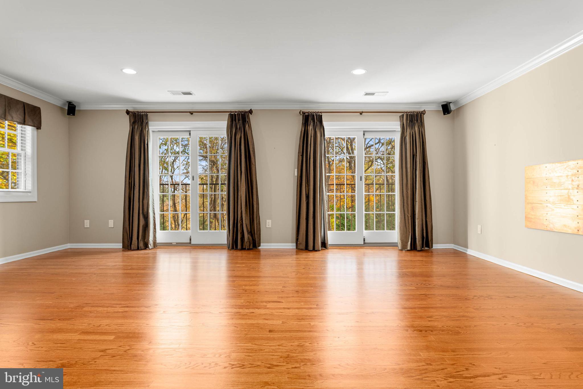 1311 Hagys Ford Road Penn Valley, PA 19072 - Photo 30 of 80 a view of an empty room with glass door and a window