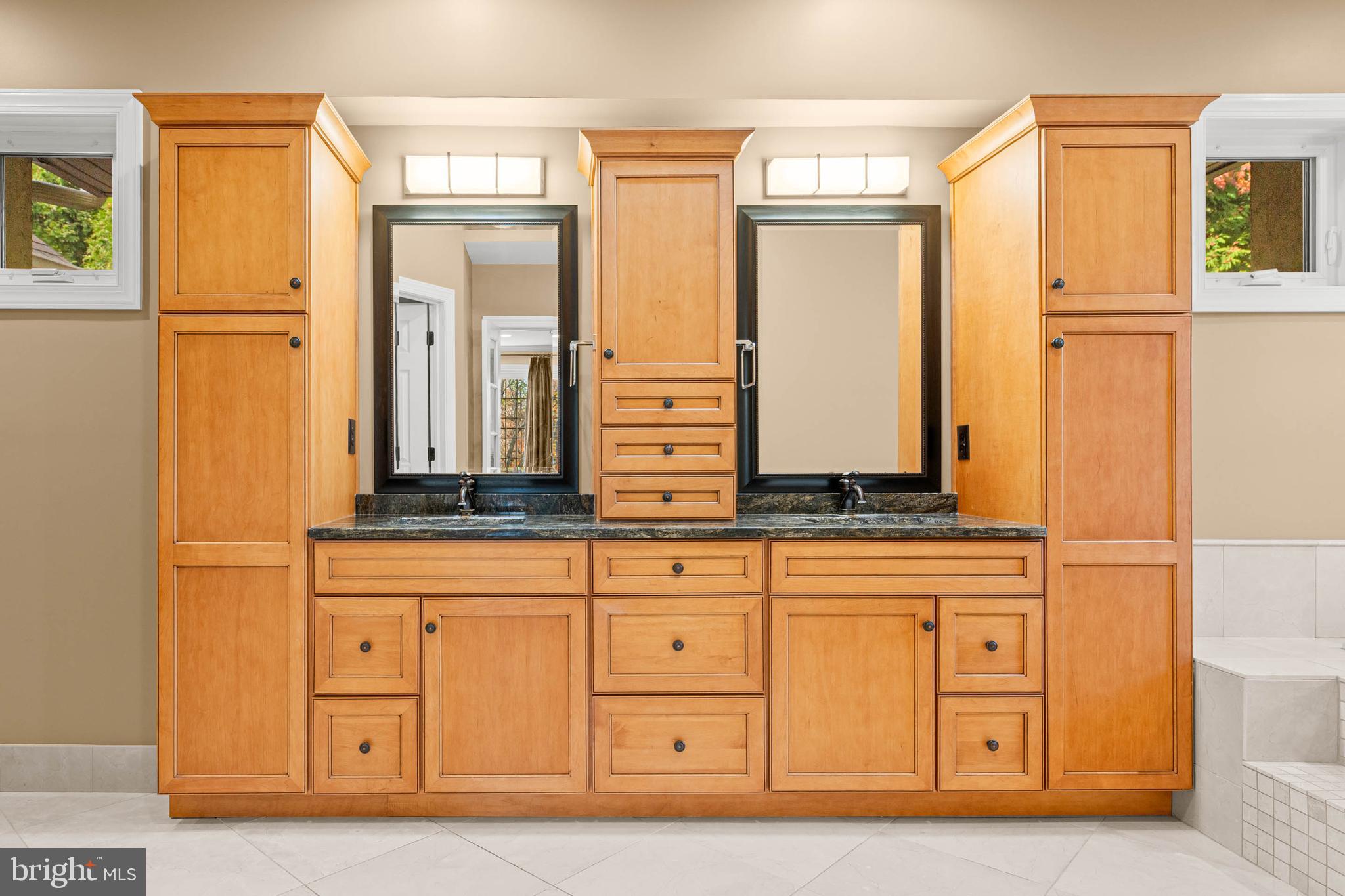 1311 Hagys Ford Road Penn Valley, PA 19072 - Photo 34 of 80 a bathroom with a double vanity sink and a mirror
