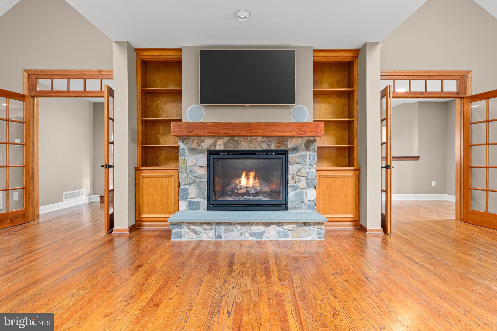1311 Hagys Ford Road Penn Valley, PA 19072 - Photo 42 of 80 a living room with a fireplace and wooden floor