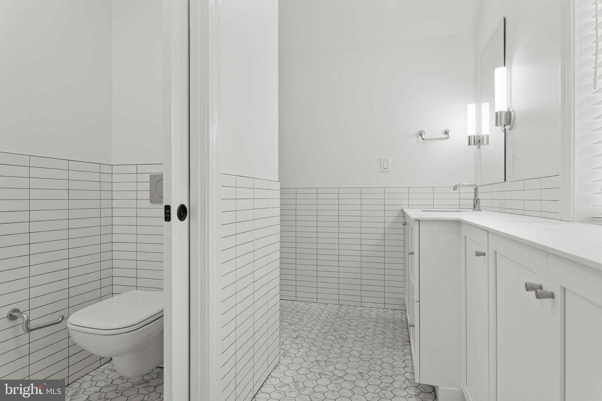 1311 Hagys Ford Road Penn Valley, PA 19072 - Photo 55 of 80 a bathroom with a sink a toilet and shower