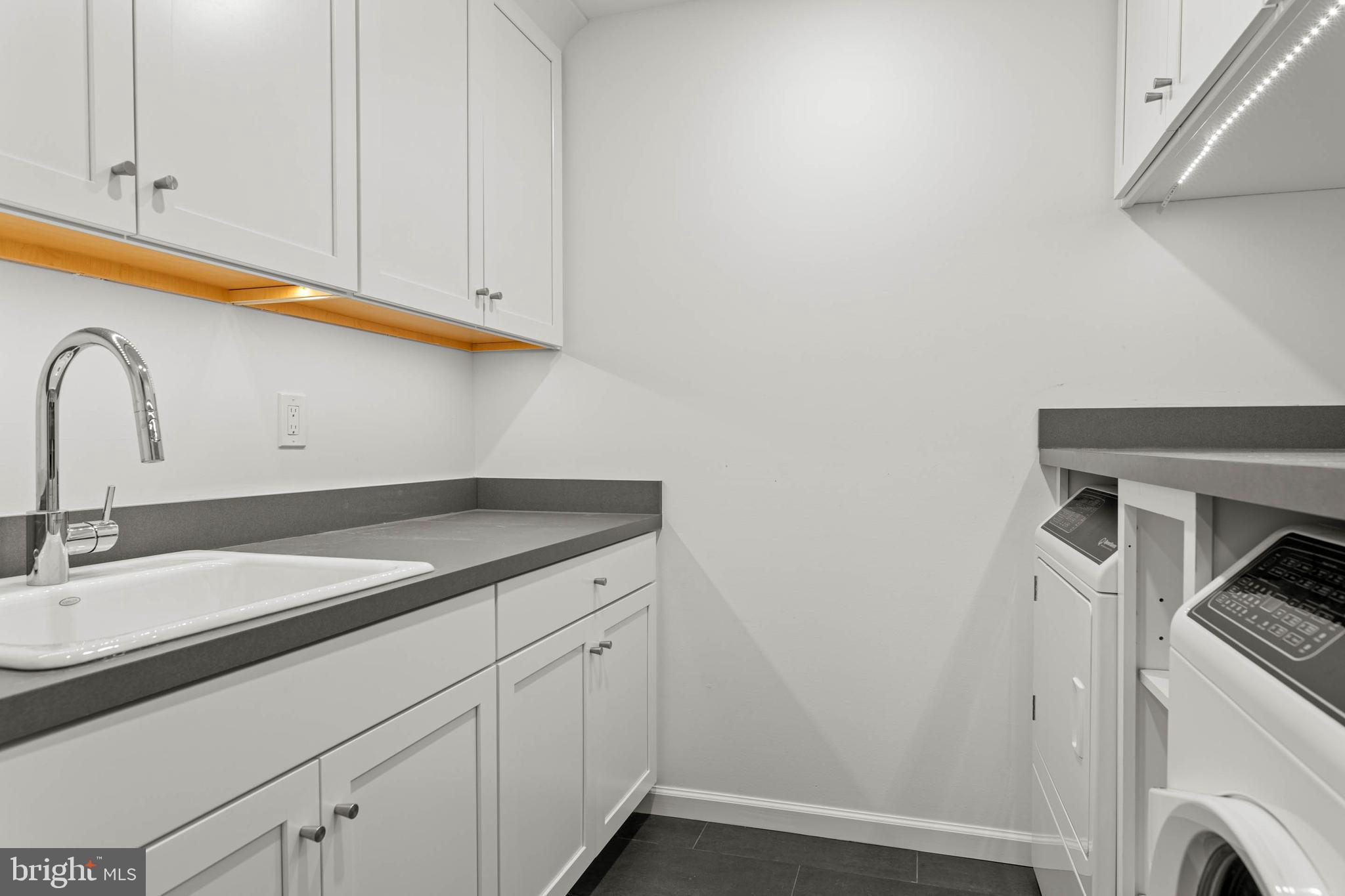 1311 Hagys Ford Road Penn Valley, PA 19072 - Photo 57 of 80 a bathroom with a sink and a mirror