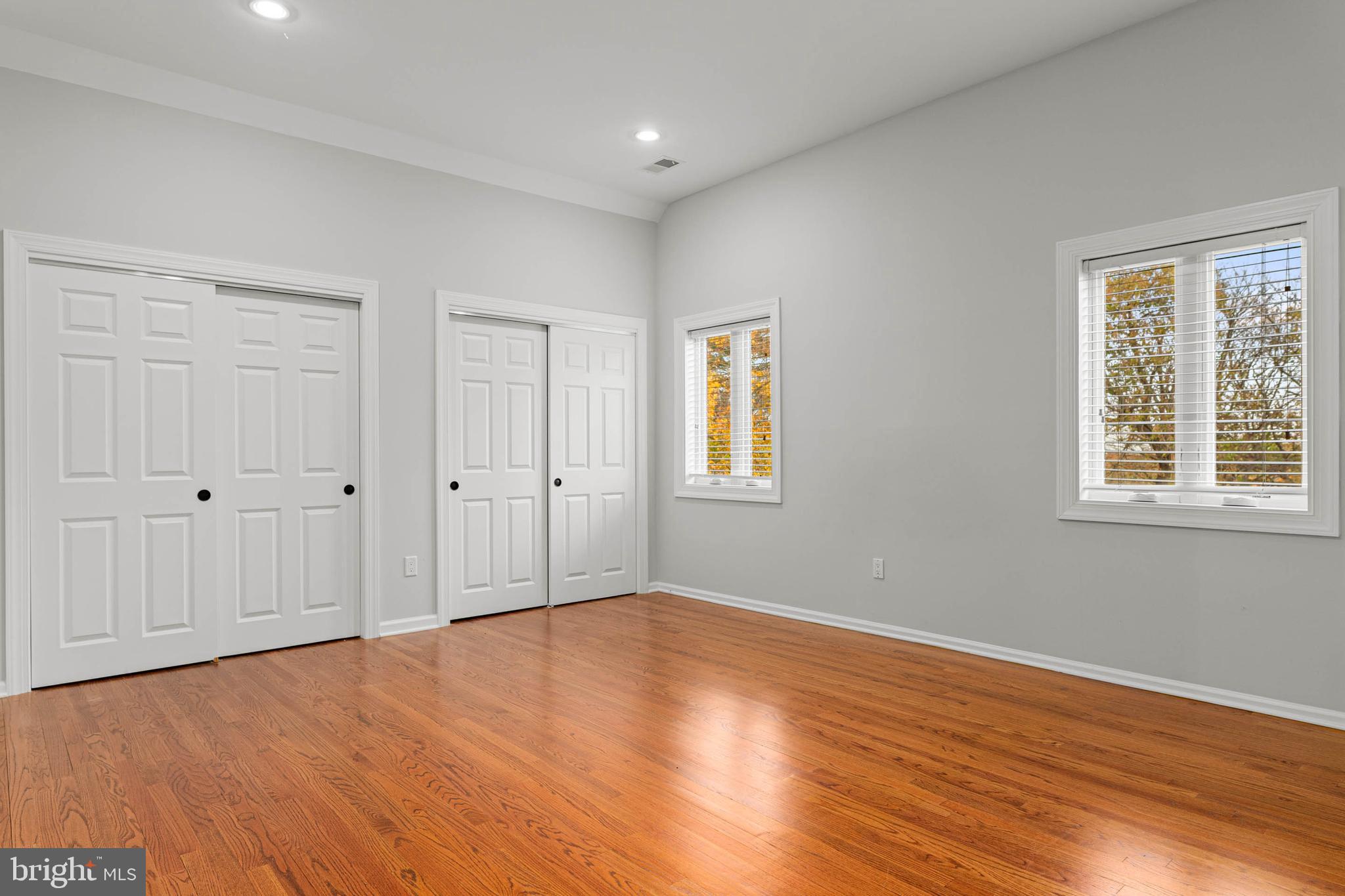 1311 Hagys Ford Road Penn Valley, PA 19072 - Photo 61 of 80 a view of empty room with wooden floor and windows