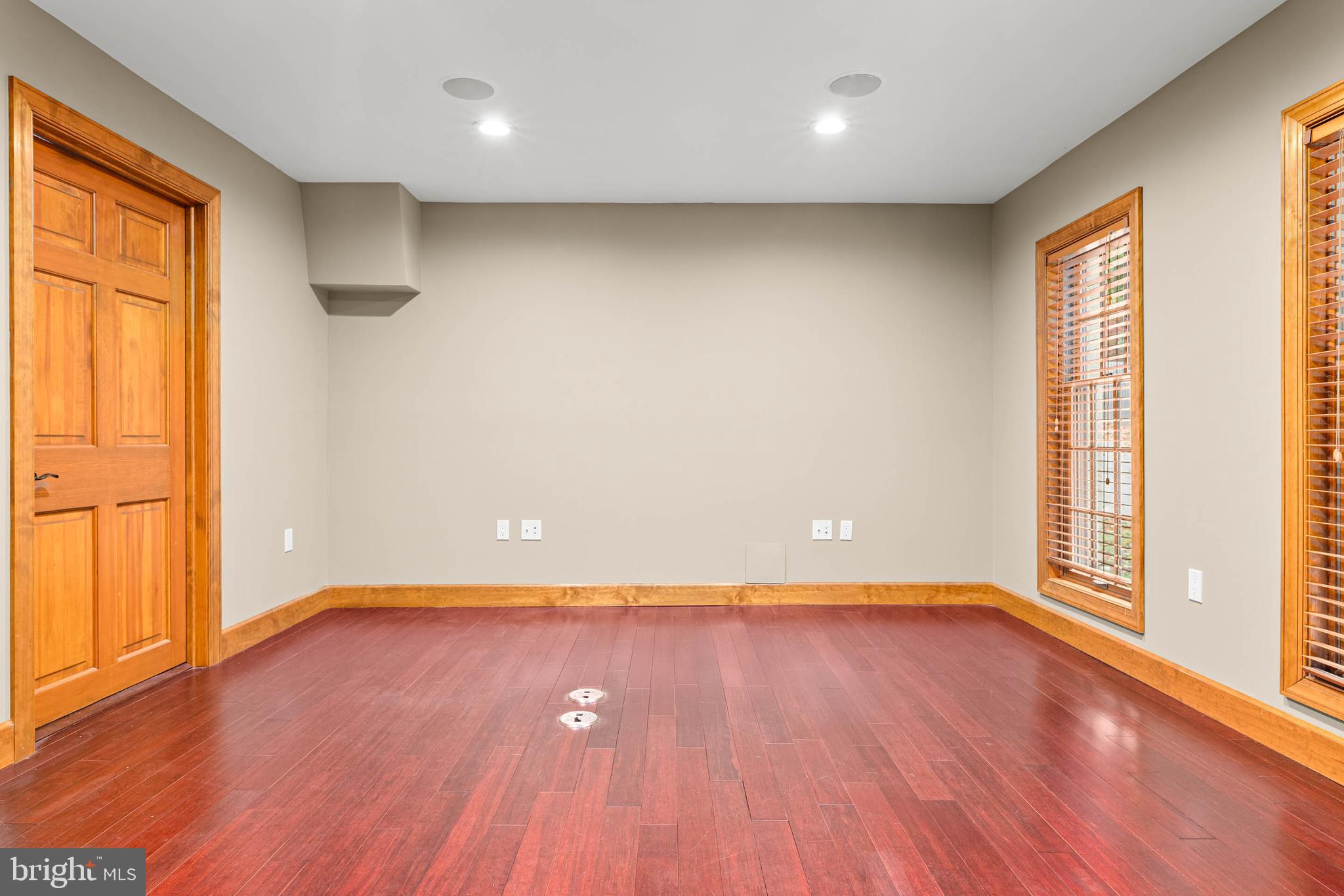 1311 Hagys Ford Road Penn Valley, PA 19072 - Photo 67 of 80 an empty room with wooden floor and windows