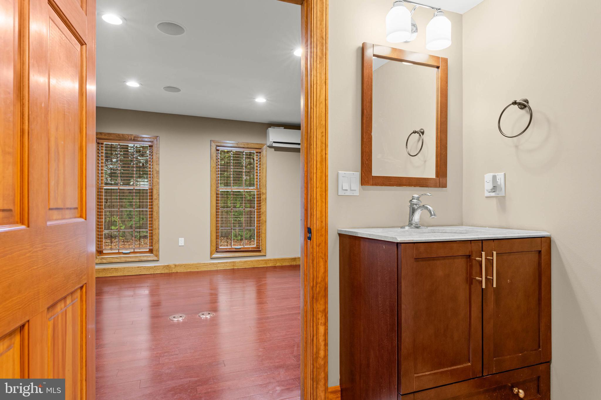 1311 Hagys Ford Road Penn Valley, PA 19072 - Photo 68 of 80 a bathroom with a sink and a mirror