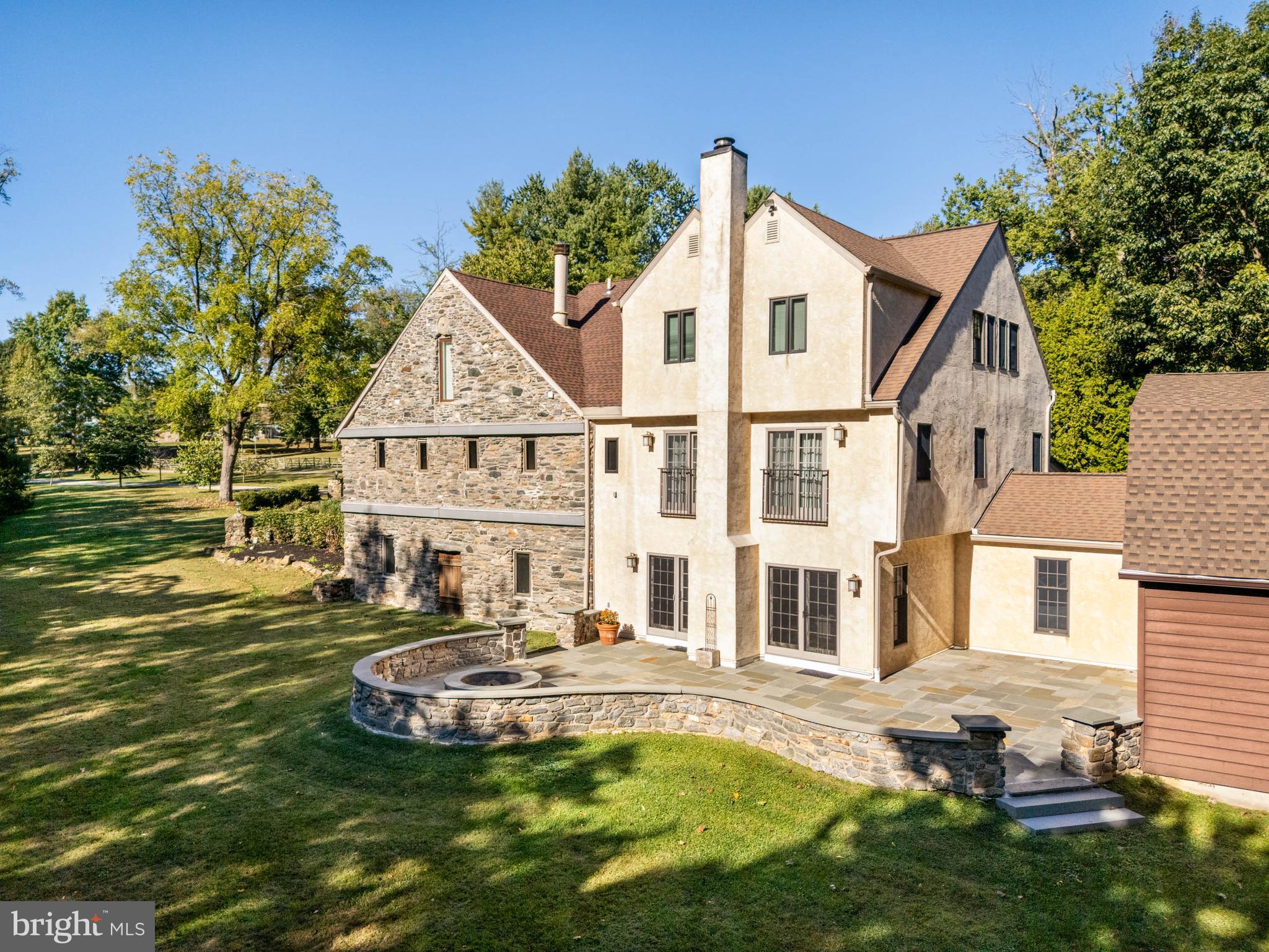 1311 Hagys Ford Road Penn Valley, PA 19072 - Photo 78 of 80 a front view of a house with a yard table and chairs