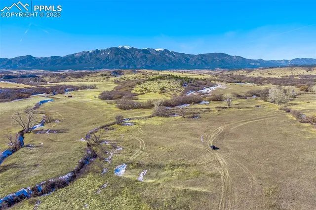 a view of an ocean and a mountain
