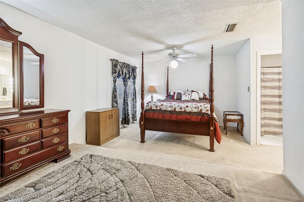 44 Merrie Circle Richardson, TX 75081 - Photo 16 of 30 a bedroom with furniture and window