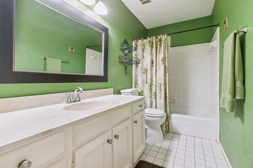 44 Merrie Circle Richardson, TX 75081 - Photo 19 of 30 a bathroom with a double vanity sink toilet and shower