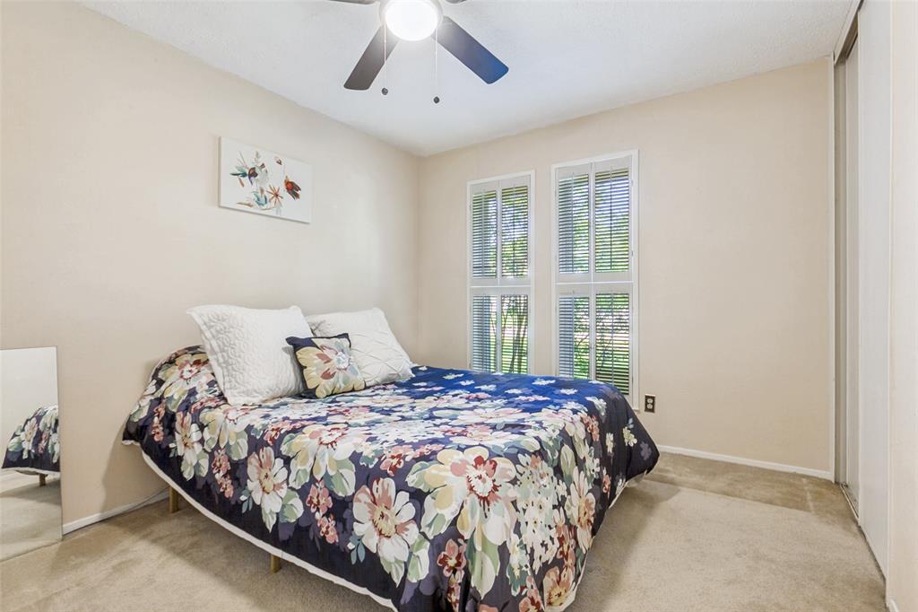 44 Merrie Circle Richardson, TX 75081 - Photo 21 of 30 a bedroom with a large bed and a window