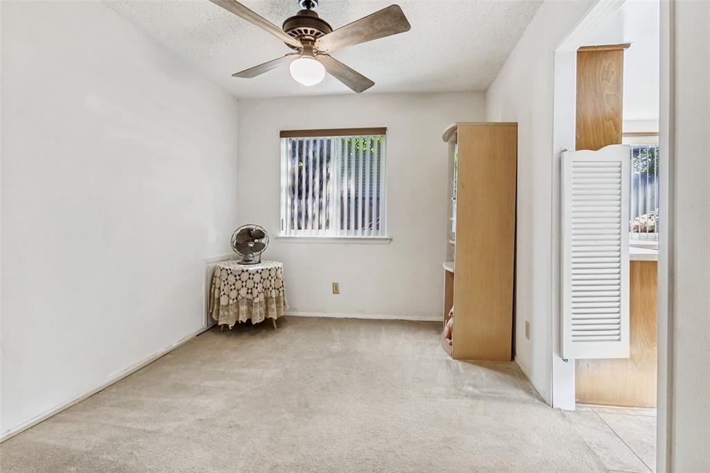 44 Merrie Circle Richardson, TX 75081 - Photo 22 of 30 an empty room with windows and fan