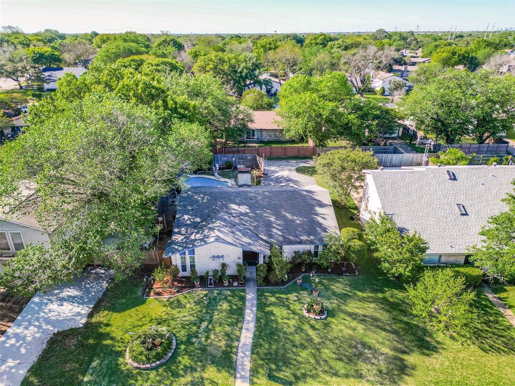 44 Merrie Circle Richardson, TX 75081 - Photo 26 of 30 a view of a garden with a building in the background