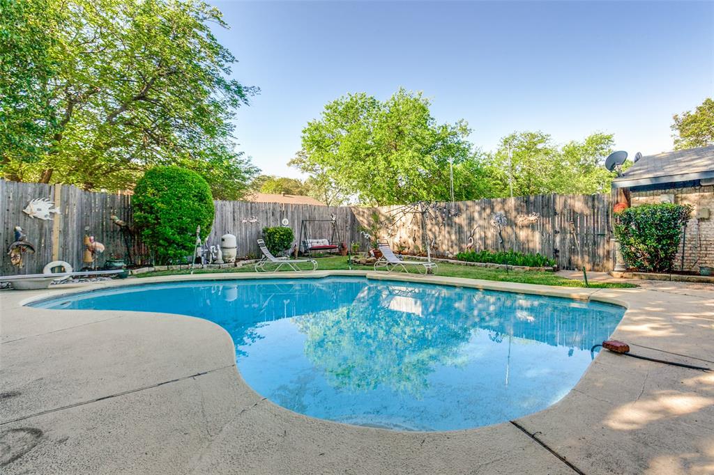 44 Merrie Circle Richardson, TX 75081 - Photo 3 of 30 a view of a swimming pool with a patio