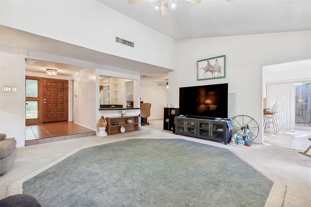 44 Merrie Circle Richardson, TX 75081 - Photo 4 of 30 a living room with furniture and a flat screen tv