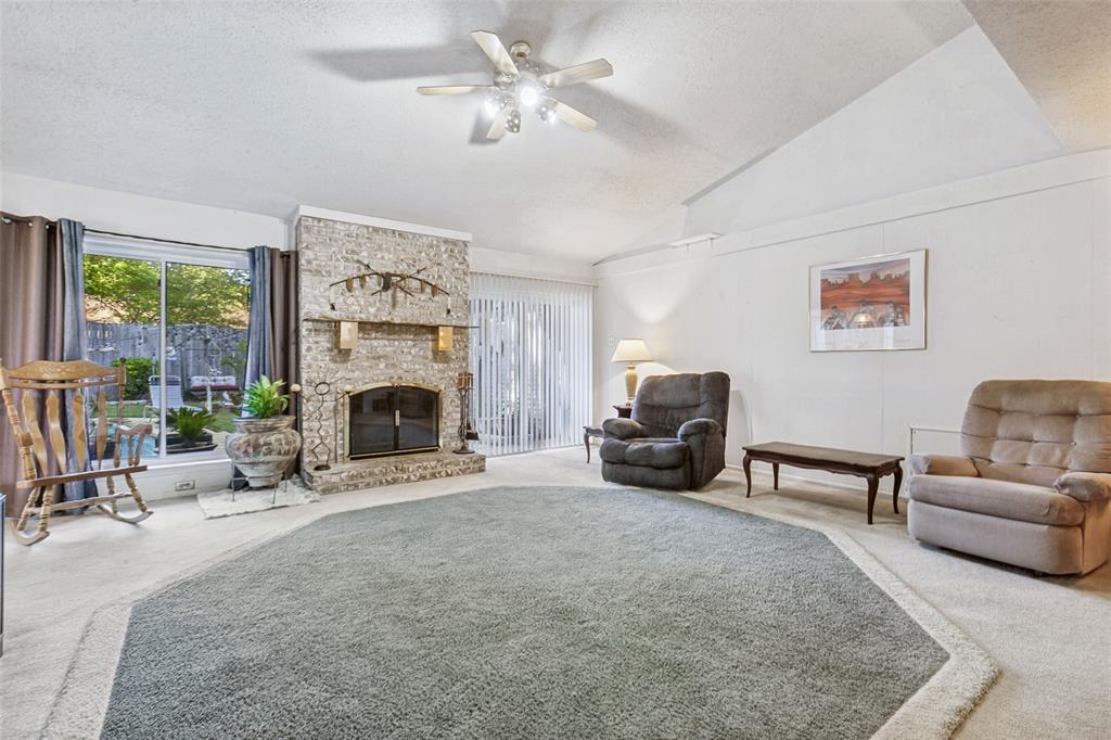 44 Merrie Circle Richardson, TX 75081 - Photo 6 of 30 a living room with furniture and a fireplace