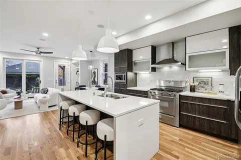 a kitchen with a sink stainless steel appliances and cabinets