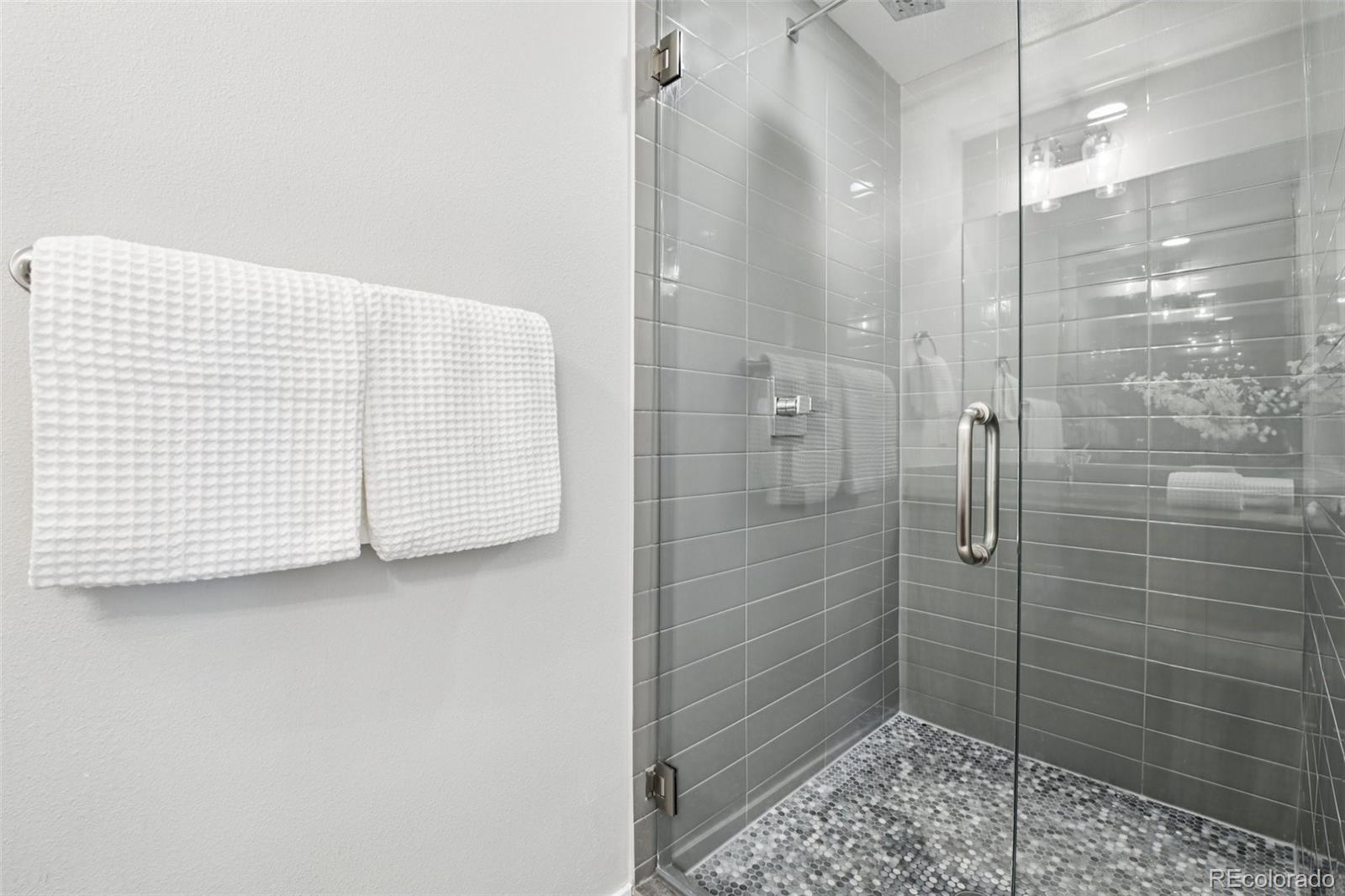 2825 Stout Street Denver, CO 80205 - Photo 20 of 42 a bathroom with a shower