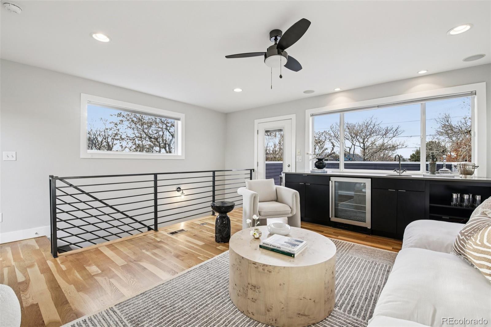 2825 Stout Street Denver, CO 80205 - Photo 29 of 42 a living room with furniture and a large window