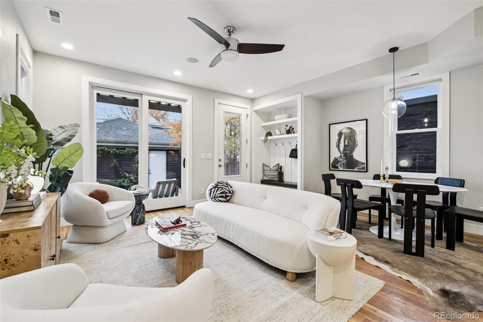 2825 Stout Street Denver, CO 80205 - Photo 7 of 42 a living room with furniture and a large window