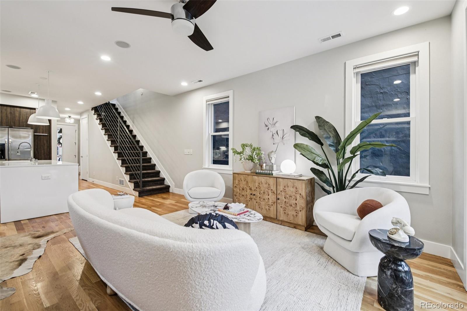 2825 Stout Street Denver, CO 80205 - Photo 9 of 42 a living room with furniture and a potted plant