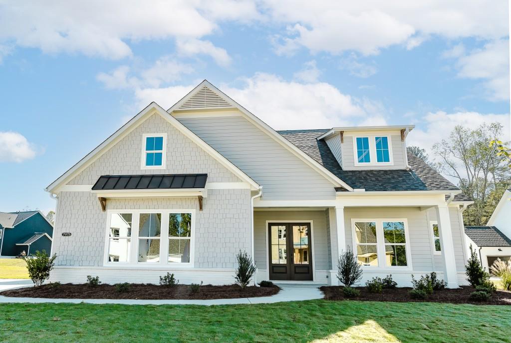 front view of a house with a yard
