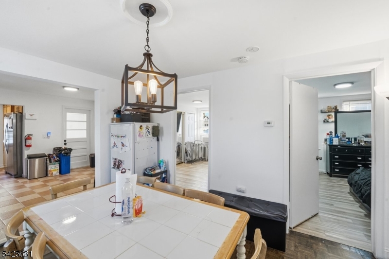 60 Westervelt Place Lodi, NJ 07644 - Photo 24 of 48 a view of a dining room with furniture and wooden floor