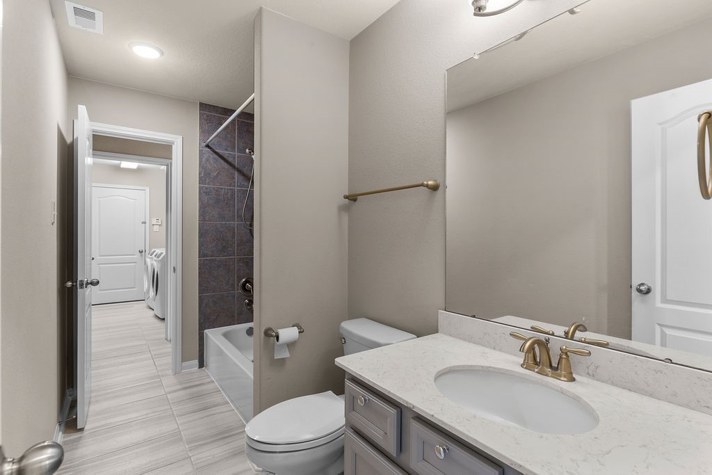 2666 Cedar Path Lane Conroe, TX 77385 - Photo 15 of 22 a bathroom with a sink toilet tub and shower