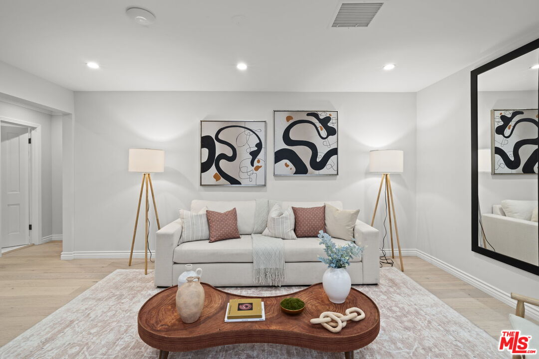 9325 Oakmore Road Los Angeles, CA 90035 - Photo 14 of 46 a living room with furniture and white walls