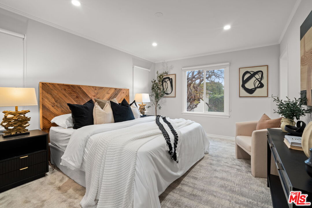 9325 Oakmore Road Los Angeles, CA 90035 - Photo 19 of 46 a bed room with a bed and a couch