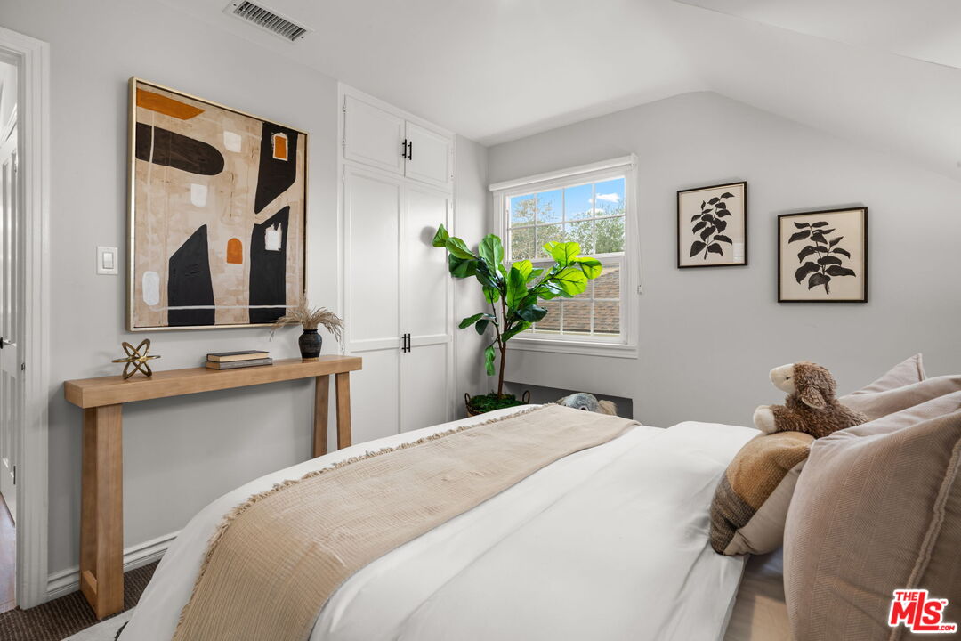 9325 Oakmore Road Los Angeles, CA 90035 - Photo 32 of 46 a bedroom with a bed and a couch