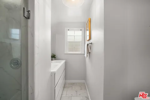 a bathroom with a sink and mirror