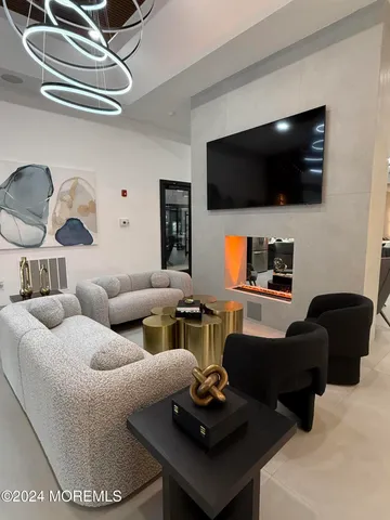 a room with stainless steel appliances kitchen island a large island in the center